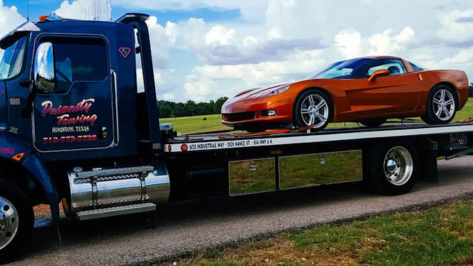 Priority Towing specialty vehicle towing — sports car on a flatbed